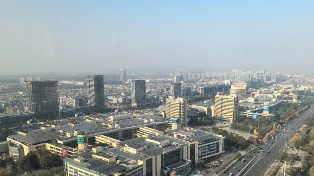 City skyline with tall buildings and roads