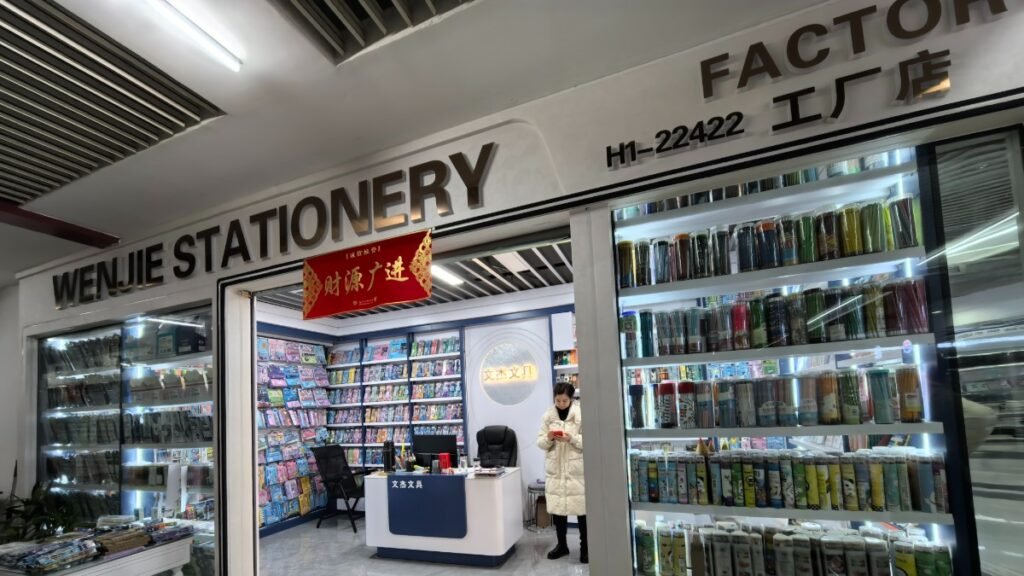 Inside a stationery store with shelves of supplies.