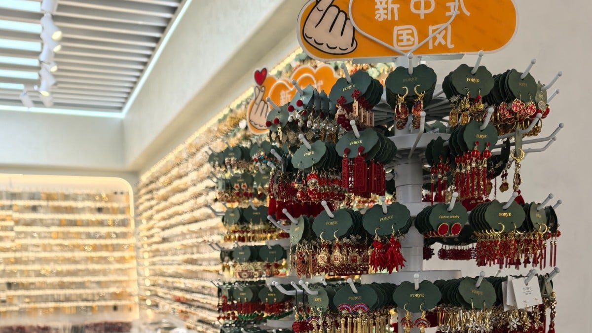 A variety of earrings displayed on a rack