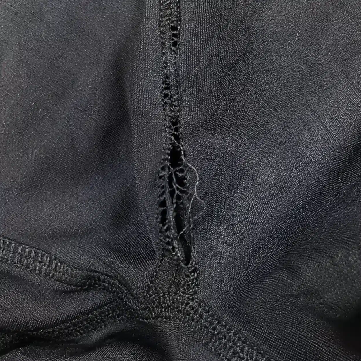 Macro close-up of a white cotton canvas fabric swatch showing the weave density