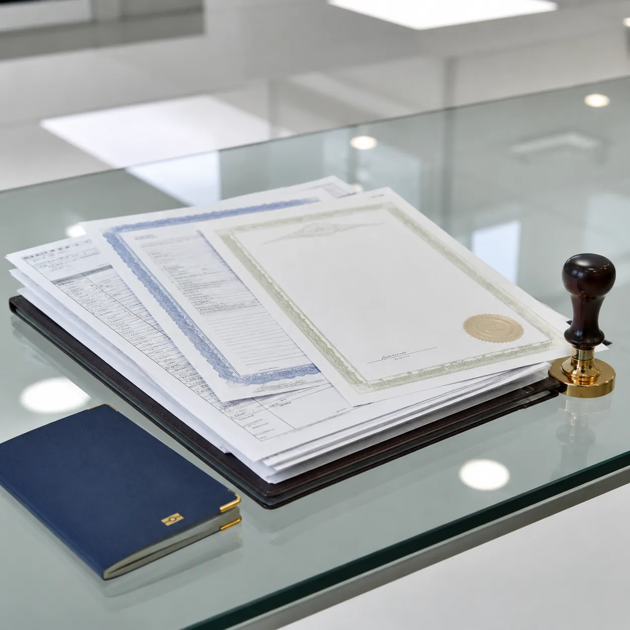 Hyper-realistic product photography, a stack of official documents including an export license, a customs declaration form, and a compliance certificate, a seal stamp next to them, glass desk with a passport, bright ceiling light, clean composition, no text, no brand logo